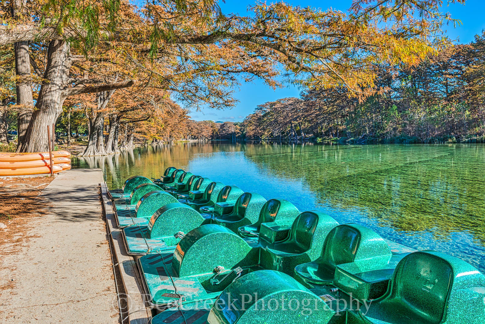 America, American, Frio River, Garner State Park, blue green waters, blue water, colorful, cypress trees, emerald, fall, fall colors, fall cypress trees, fall trees, images of Texas, kayaks, landscape
