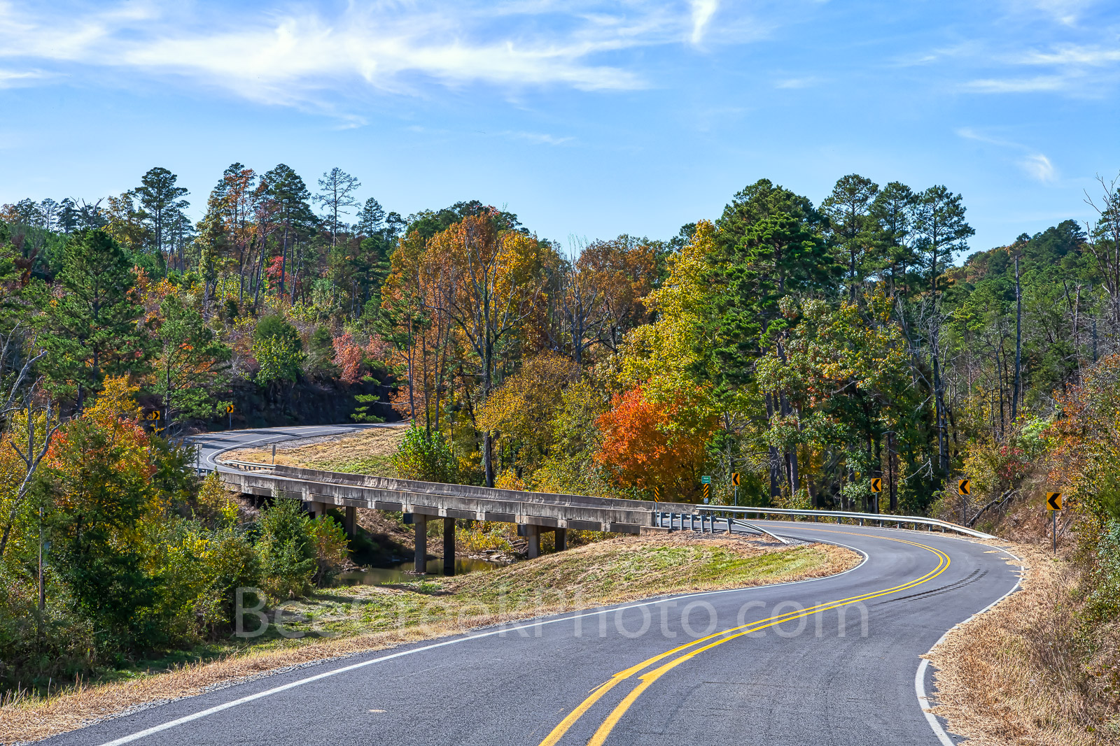 Ozark Country Drive - A windy road across a bridge in the Ozark on a fall day with these colorful trees on this scenic drive...