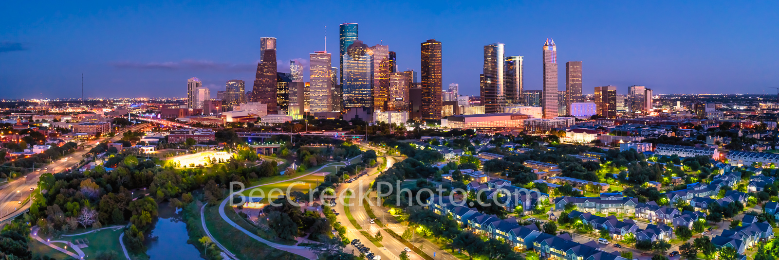 Houston Skyline at Twilight Panorama - Houston skyline pano at twilight hour with Allen Parkway as it runs along the Buffalo...